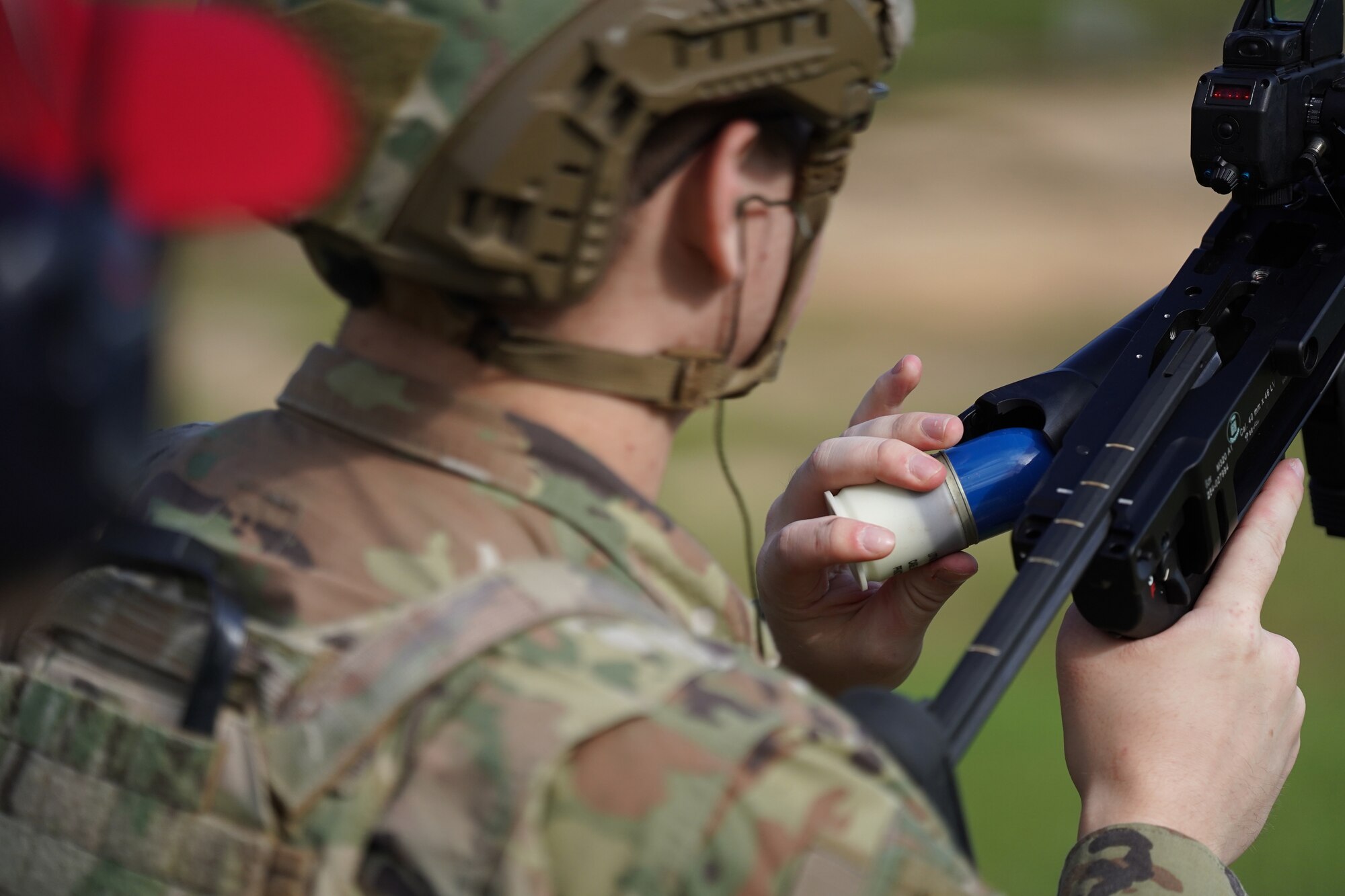 U.S. Air Force Airman 1st Class Connor Moffett, 81st Security Forces Squadron entry controller, loads the M320A1 on range 14 B at Camp Shelby, Mississippi, Sept. 23, 2022. Defenders rotate through firing different heavy weapon systems to hone their defense capabilities.