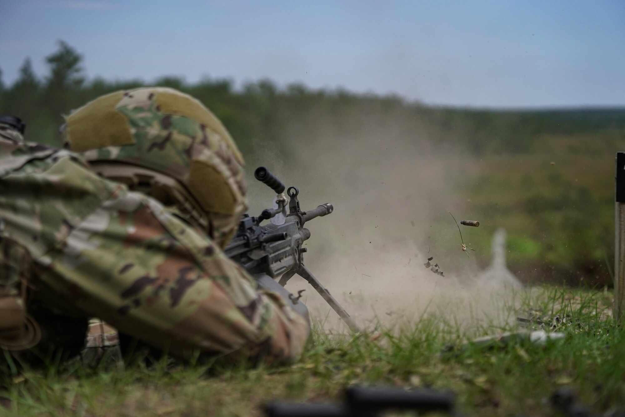 U.S. Air Force Airman Kenneth Shattwell, 81st Security Forces Squadron entry controller, fires M249 on range 14 B at Camp Shelby, Mississippi, Sept. 23, 2022. Defenders rotate through firing different heavy weapon systems to hone their defense capabilities
