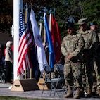 Command Sgt. Maj. Richard G. Thalman and Chief Master Sgt. Brian L. Garrett, along with others bow their heads in remembrance of service members who have lost their lives in service to their country, at Camp Williams, Utah, Sept. 24, 2022, during the 67th annual Governor’s Day.