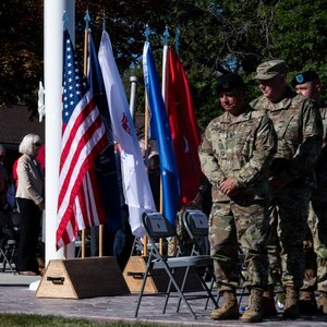 Command Sgt. Maj. Richard G. Thalman and Chief Master Sgt. Brian L. Garrett, along with others bow their heads in remembrance of service members who have lost their lives in service to their country, at Camp Williams, Utah, Sept. 24, 2022, during the 67th annual Governor’s Day.
