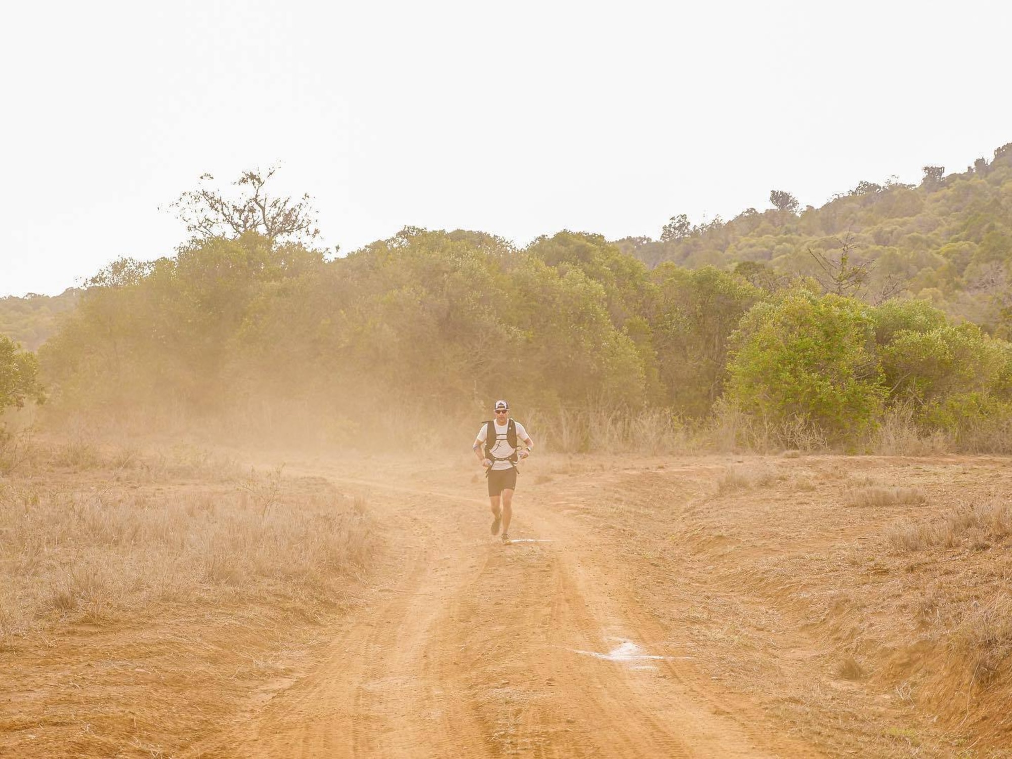 Airman runs on dirt roads through African conservancies.