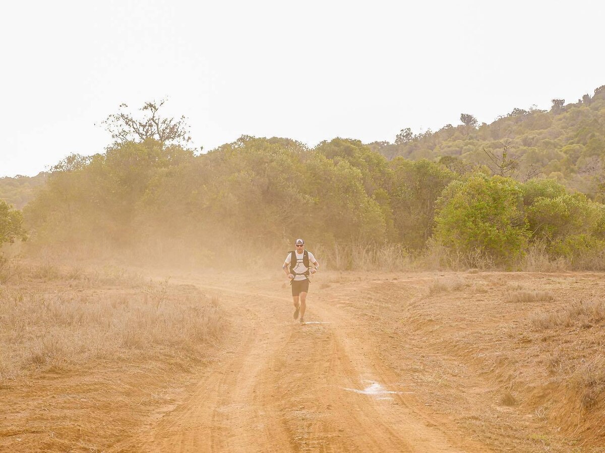 Airman runs on dirt roads through African conservancies.