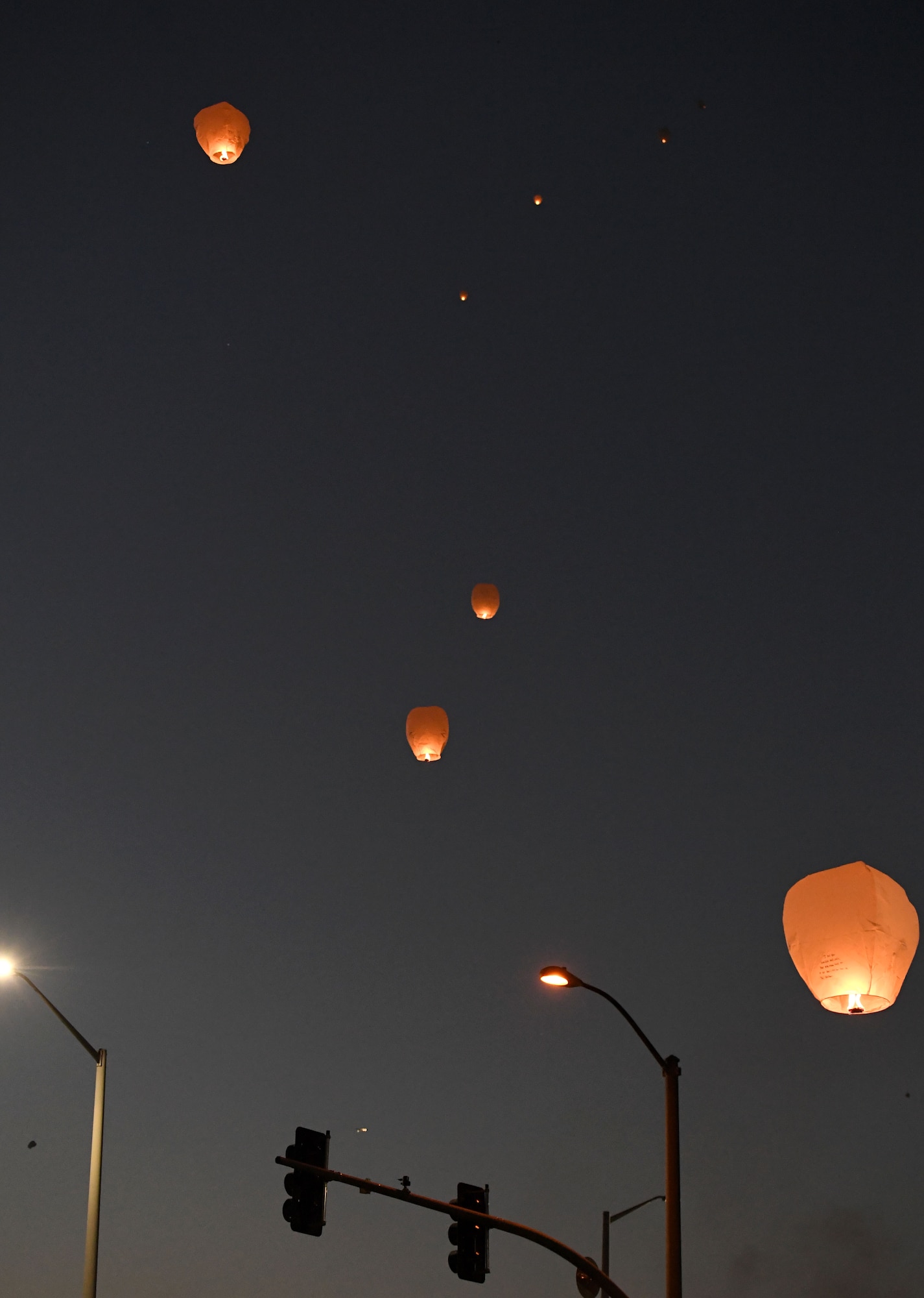 Lanterns light the sky during the Gold Star Families Sky Lantern Release on the Biloxi Beach, Mississippi, Sept. 23, 2022. The event, hosted by Keesler Air Force Base, included eco-friendly sky lanterns released in honor of fallen heroes. (U.S. Air Force photo by Kemberly Groue)