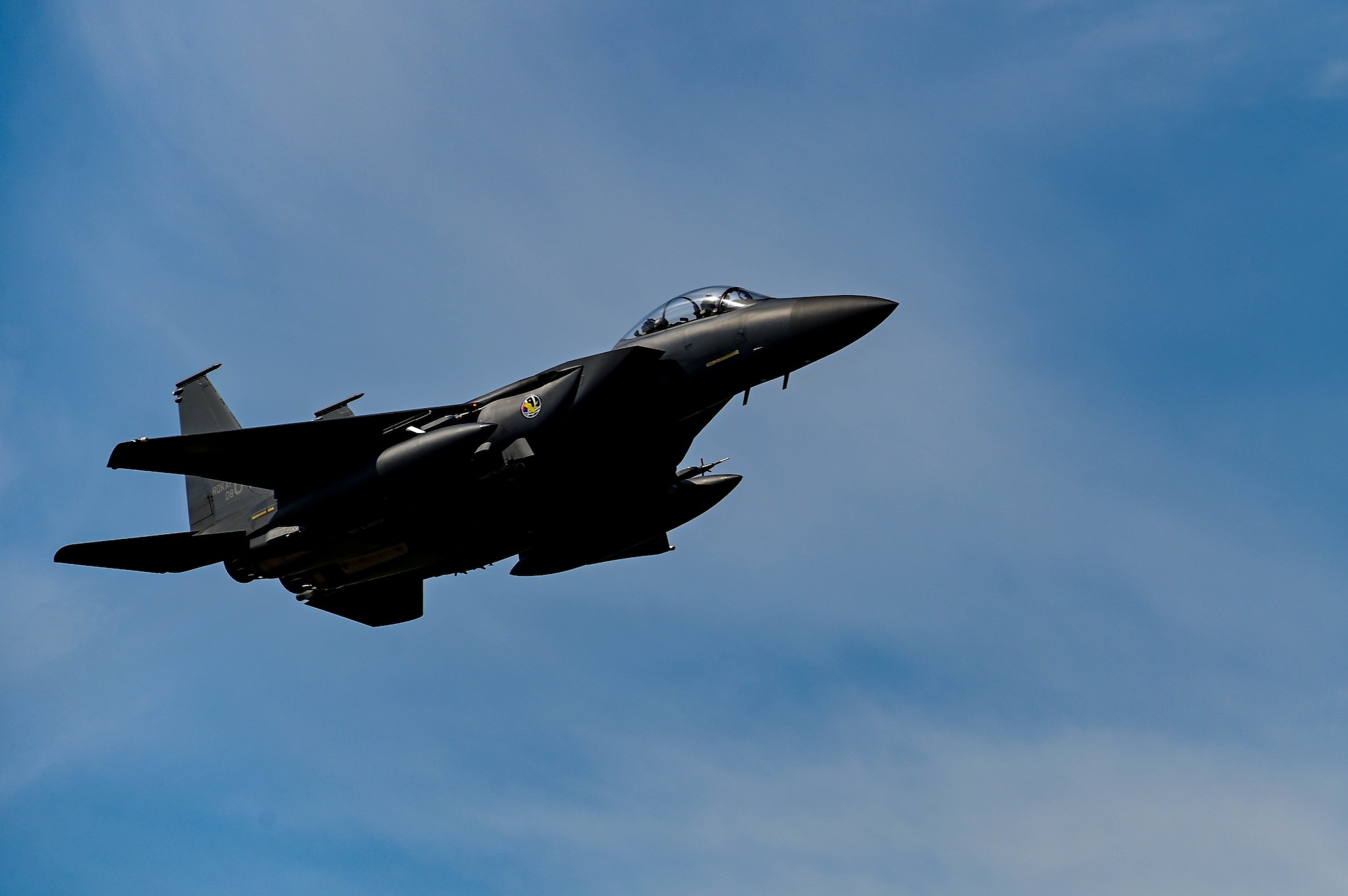 A Republic of Korea Air Force F-15K Slam Eagle assigned to the 110th Fighter Squadron soars through the sky during routine training at Kunsan Air Base, Republic of Korea, Sept. 22, 2022. During the training, ROKAF and U.S. pilots increased force interoperability by practicing air-to-air and air-to-ground tactics. (U.S. Air Force Photo by Senior Airman Shannon Braaten)