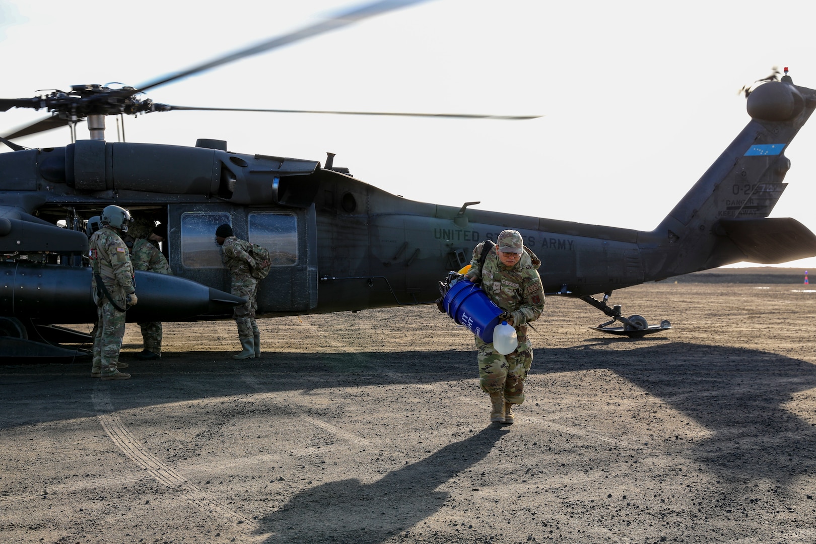 Alaska Air National Guard Staff Sgt. Kua Xiong, a services technician with the 176th Force Support Squadron, arrives in Toksook Bay, Alaska, via a UH-60L Black Hawk helicopter assigned to A Company, 1st Battalion, 168th Aviation Regiment, to assist in debris cleanup as part of Operation Merbok Response Sept. 24, 2022. More than 130 members of the Alaska National Guard, Alaska State Defense Force and Alaska Naval Militia were activated after the remnants of Typhoon Merbok caused dramatic flooding across more than 1,000 miles of Alaskan coastline.