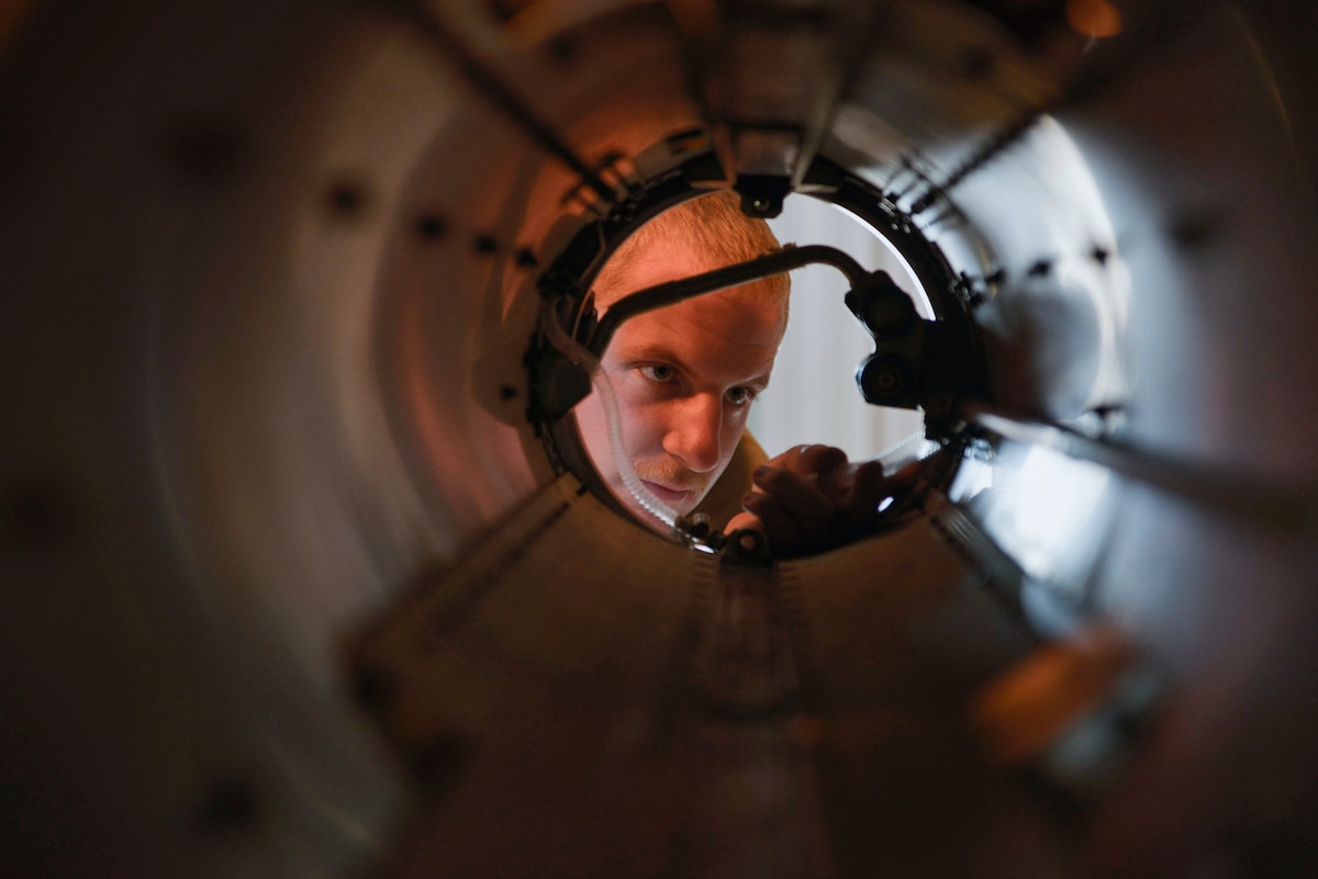 U.S. Air Force Airman 1st class Joel T. Schlim, 36th Electronic Warfare Squadron technician, removes a water-fill port tube on a AN/ALQ-184 Electronic Attack Pod for the Reclamation of Electronic Attack Pods (REAP) Program at Eglin Air Force Base, Florida, September 15, 2022. The REAP program involves two goals; first, to provide diagnostic capabilities forassets received from reclaimed ALQ- AN/ALQ-184 Pods and second; to provide the U.S. Air Force the most cost-effective solution to introduce assets back into supply to sustain the fleet. (U.S. Air Force photo by Staff Sgt. Ericka A. Woolever)
