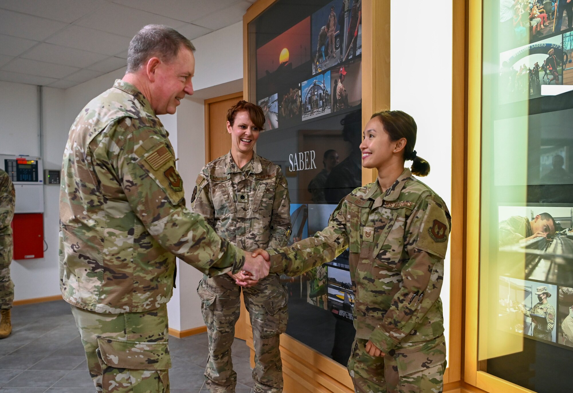 General James Hecker, U.S. Air Forces in Europe – Air Forces Africa commander, coins Tech. Sgt. Patricia Arce, 52nd Operational Medical Readiness Squadron non-commissioned officer in charge instrument processing center, for excelling at her duties.
