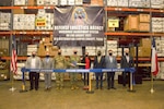 Defense Logistics Agency (DLA) Warehouse Management System ribbon cutting ceremony in Corpus Christi, Texas. Pictured (L-R) Mr. James Daniels DLA HQ J6,  Mr. Jeremy Beckwith, DLA Distribution Corpus Christi, Texas Deputy Commander, Army LTC Cody M.
Autrey, DLA Distribution Corpus Christi, Texas Commander, Navy Rear Admiral Grafton D. Chase, Commander, DLA Distribution, Ms. Karyn Runstrom SES, Deputy Chief Information Officer, DLA Information Operations, Mr. George Gray, DLA Current Operations, Mr. Ken Dinero, DLA Distribution Corpus Christi, Texas Systems Analyst, Mr. Derek Dryer, ACES.