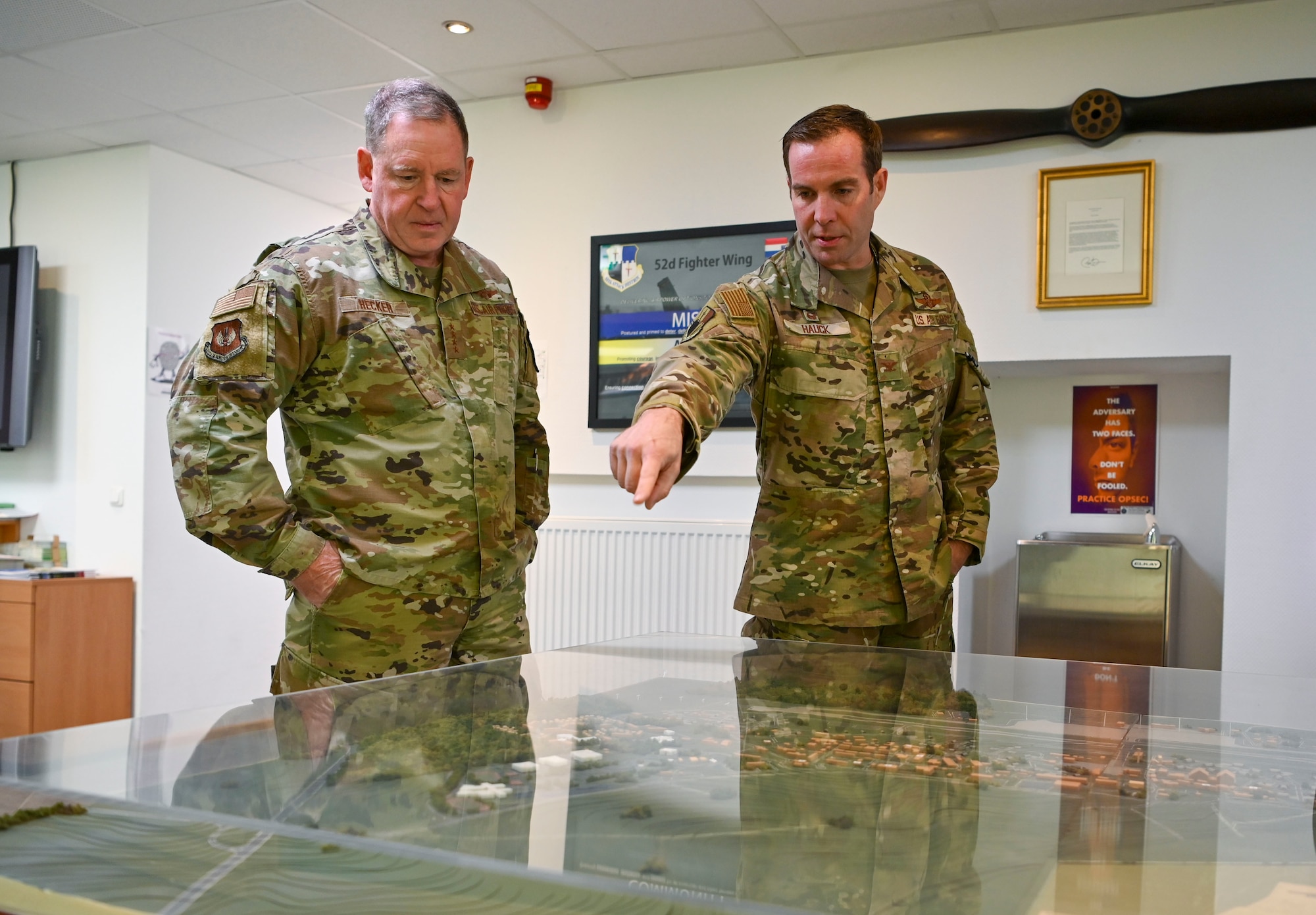 Col. Leslie Hauck, 52nd Fighter Wing commander (right), presents General James Hecker, U.S. Air Forces in Europe – Air Forces Africa commander, a map of Spangdahlem Air Base, Germany.