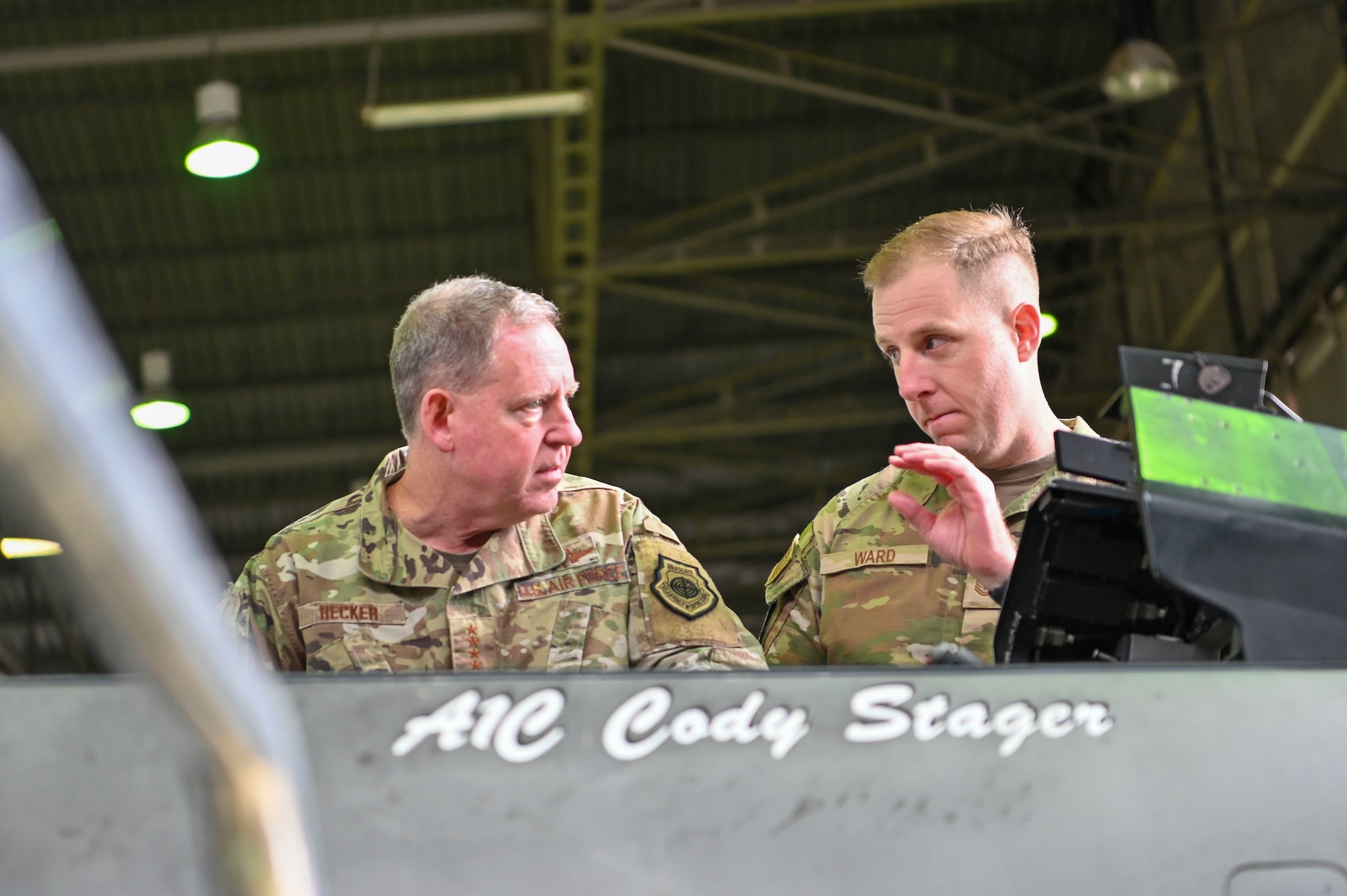 General James Hecker, U.S. Air Forces in Europe – Air Forces Africa commander (left), receives a brief from Tech Sgt. Tyler Ward, 52nd AMXS flightline expediter, on active electronically scanned array (AESA) radar systems,
