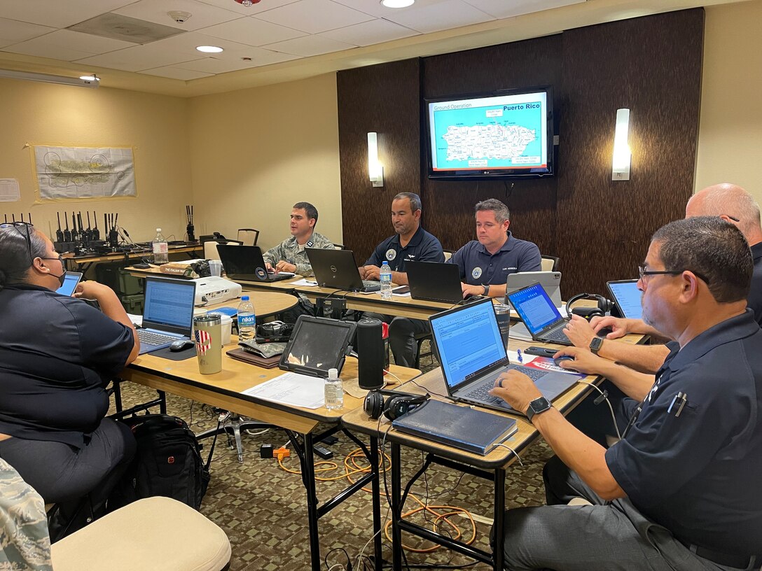 Staff work on tasking and planning at the Puerto Rico Wing incident command post in Carolina.