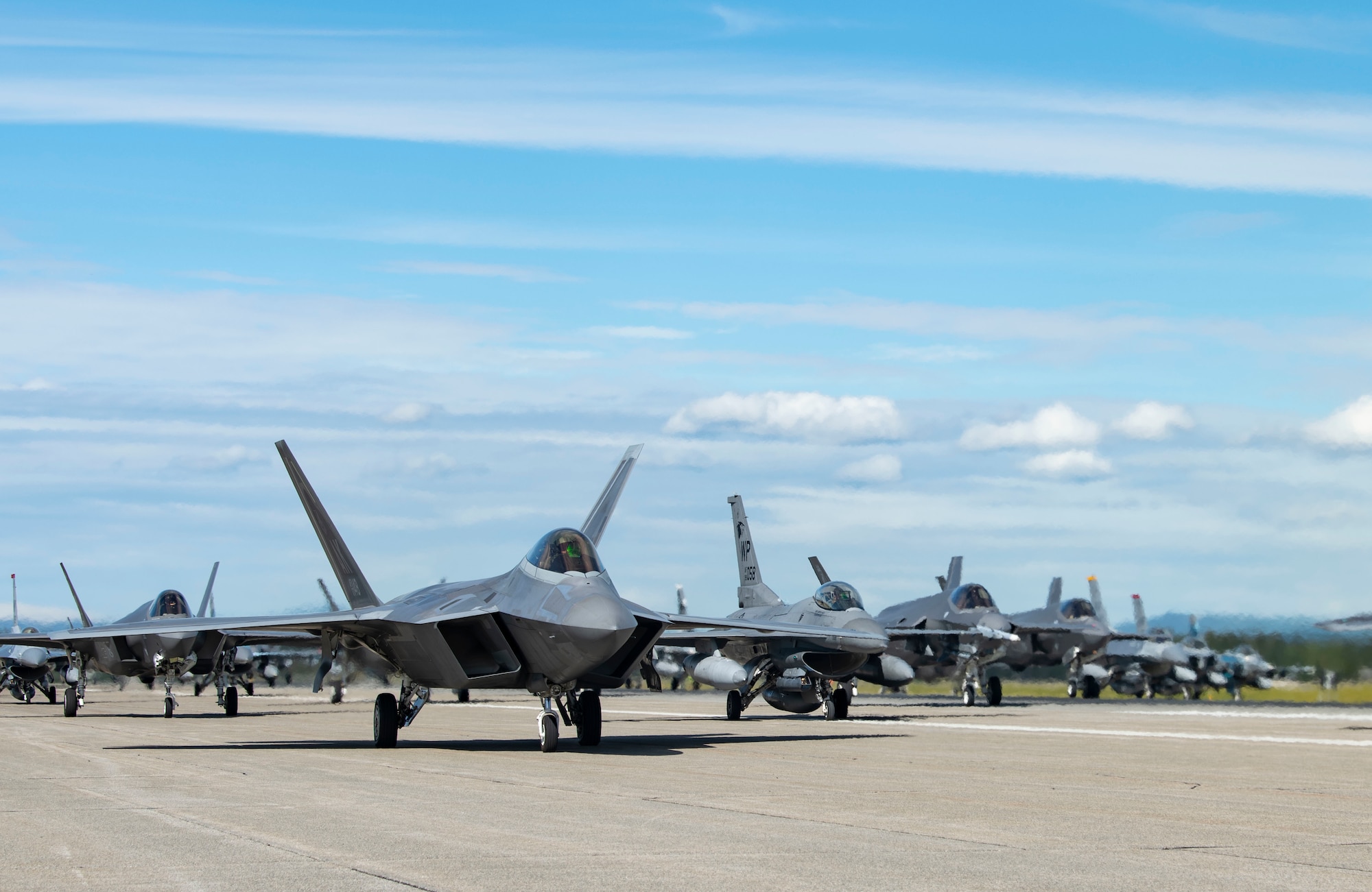 Fighter jets line up on the flightline for a capabilities demonstration