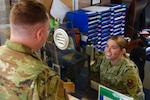 Two service members greet each other