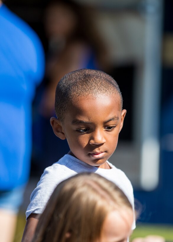 A child is pictured at the event. He is African-American.