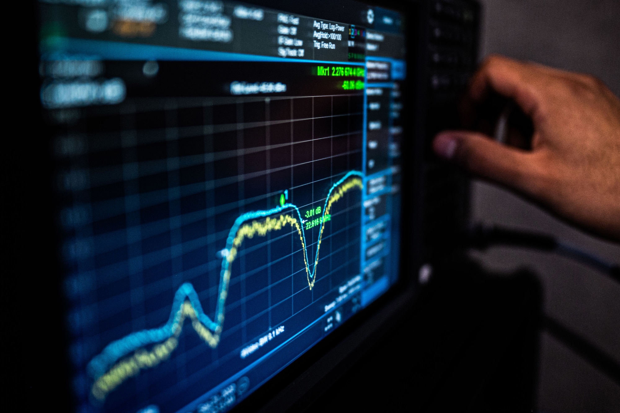 U.S. Air Force Airman 1st Class Mendoza, 216th Space Control Squadron space systems operator, adjusts a dial while looking at frequency of a signal on the monitor of a ‘Honey Badger System’ during BLACK SKIES 22