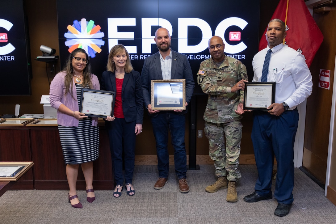 U.S. Army Corps of Engineers Kansas City District’s Brandon Meinert receives his diploma for completing the U.S. Army Engineer Research and Development Center's ERDC University, Sept. 15, 2022.