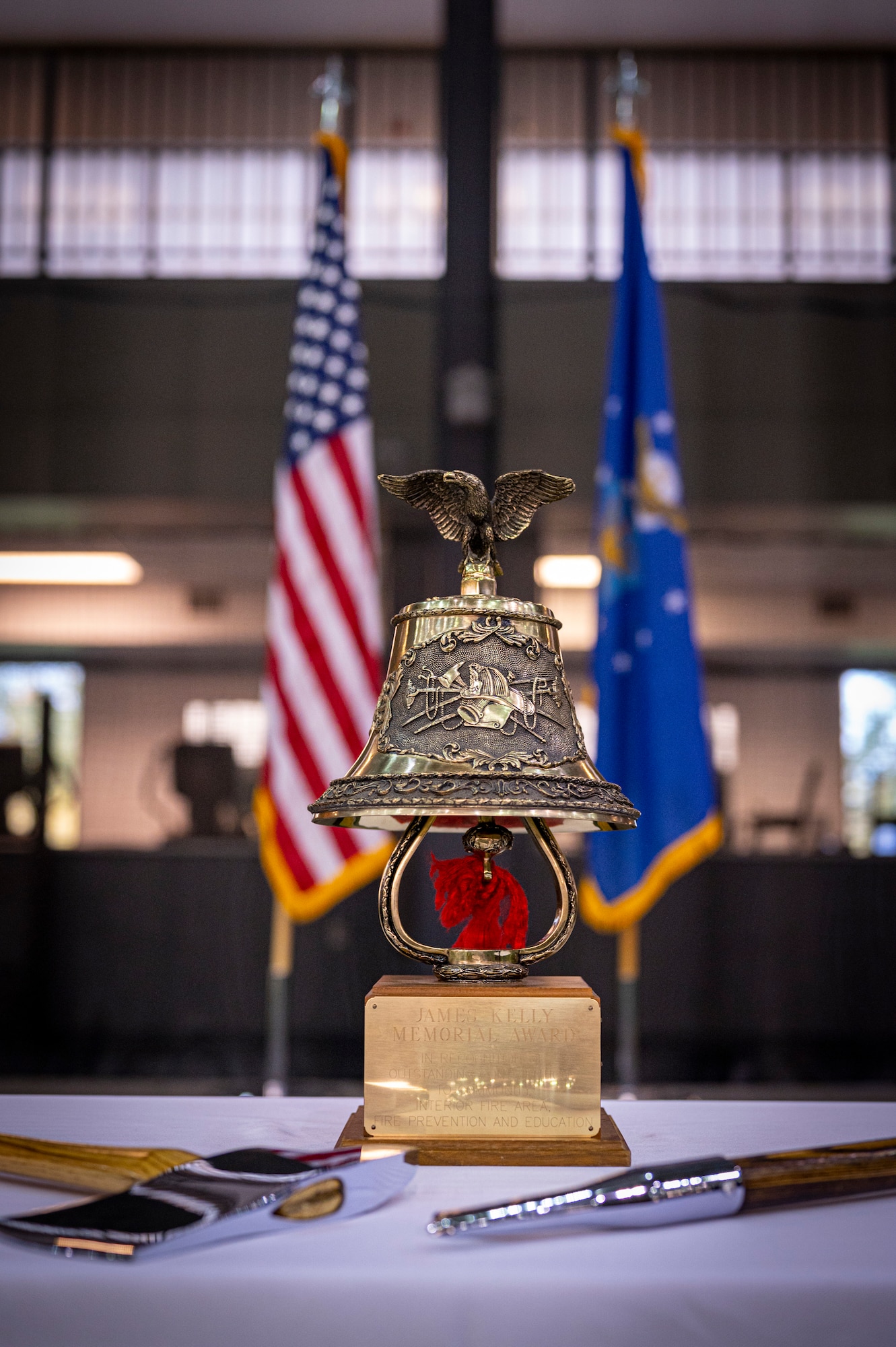 A bell stands upon a table during the ceremony.