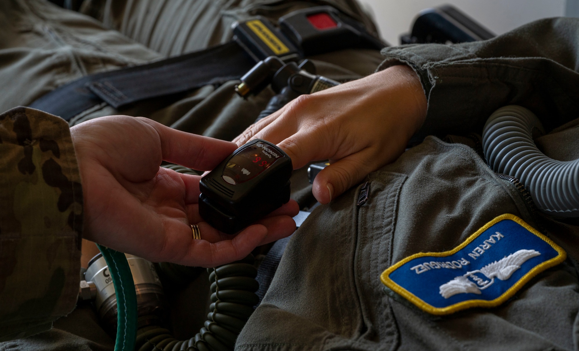 Tech. Sgt. Haley Bass, 4th Medical Group flight medicine NCO in charge, checks the vitals of Capt. Karen Rodriguez, 4th MDG flight surgeon at Seymour Johnson Air Force Base, North Carolina, Sept. 23, 2022. The 4th MDG flight medicine unit supports all aircrew by determining flight fitness, detecting medical hazards and managing medicine programs. (U.S. Air Force photo by Airman 1st Class Sabrina Fuller)