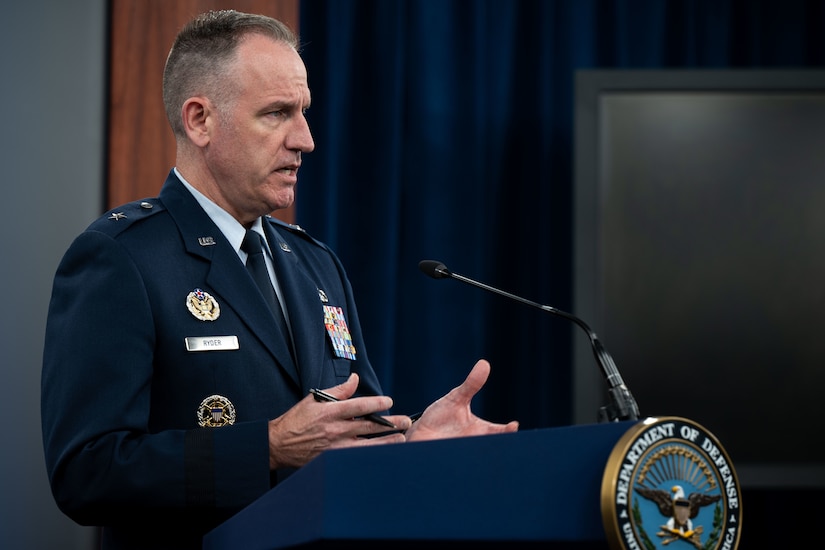 A man speaks from podium.