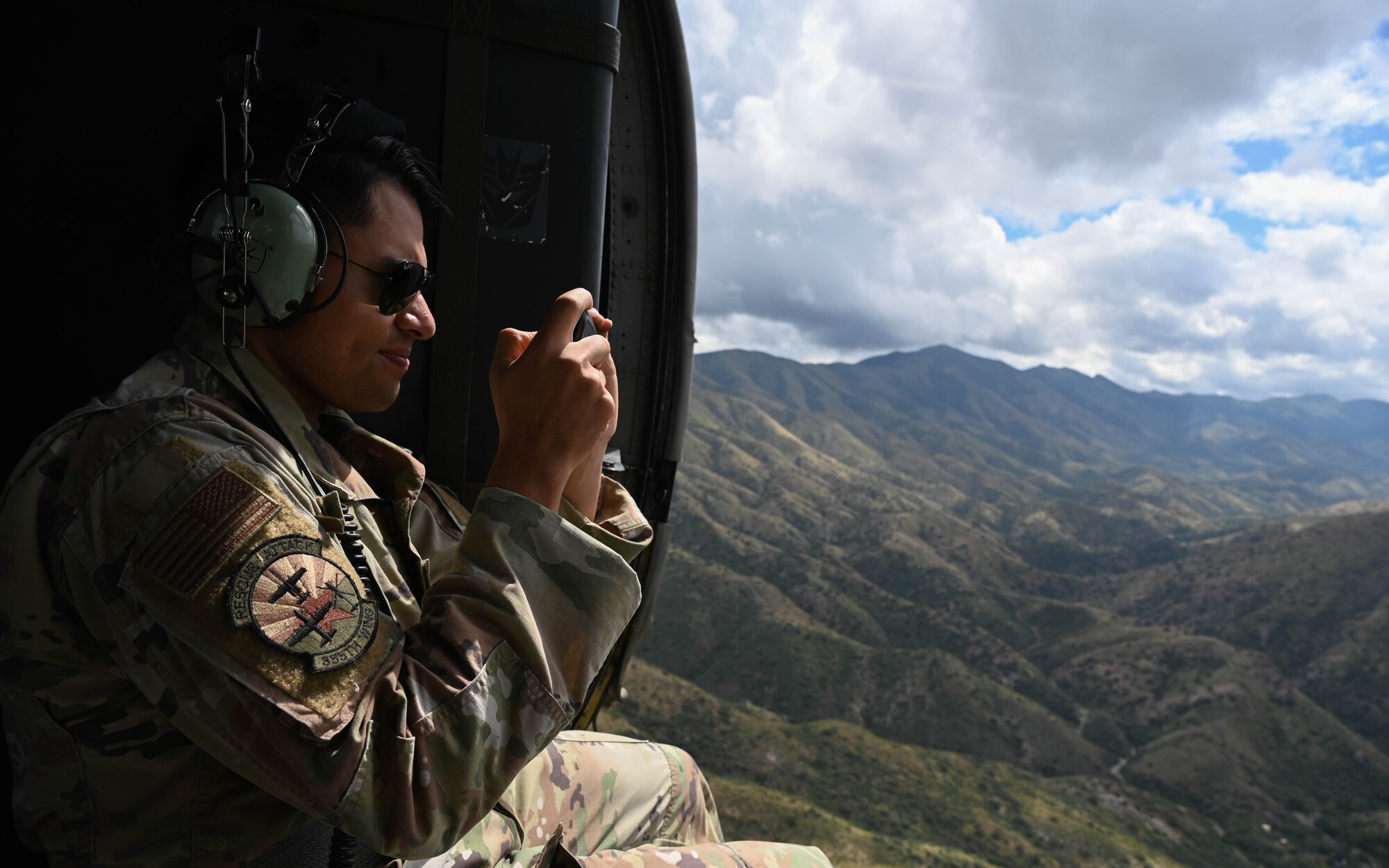 A photo of a man in a helicopter.