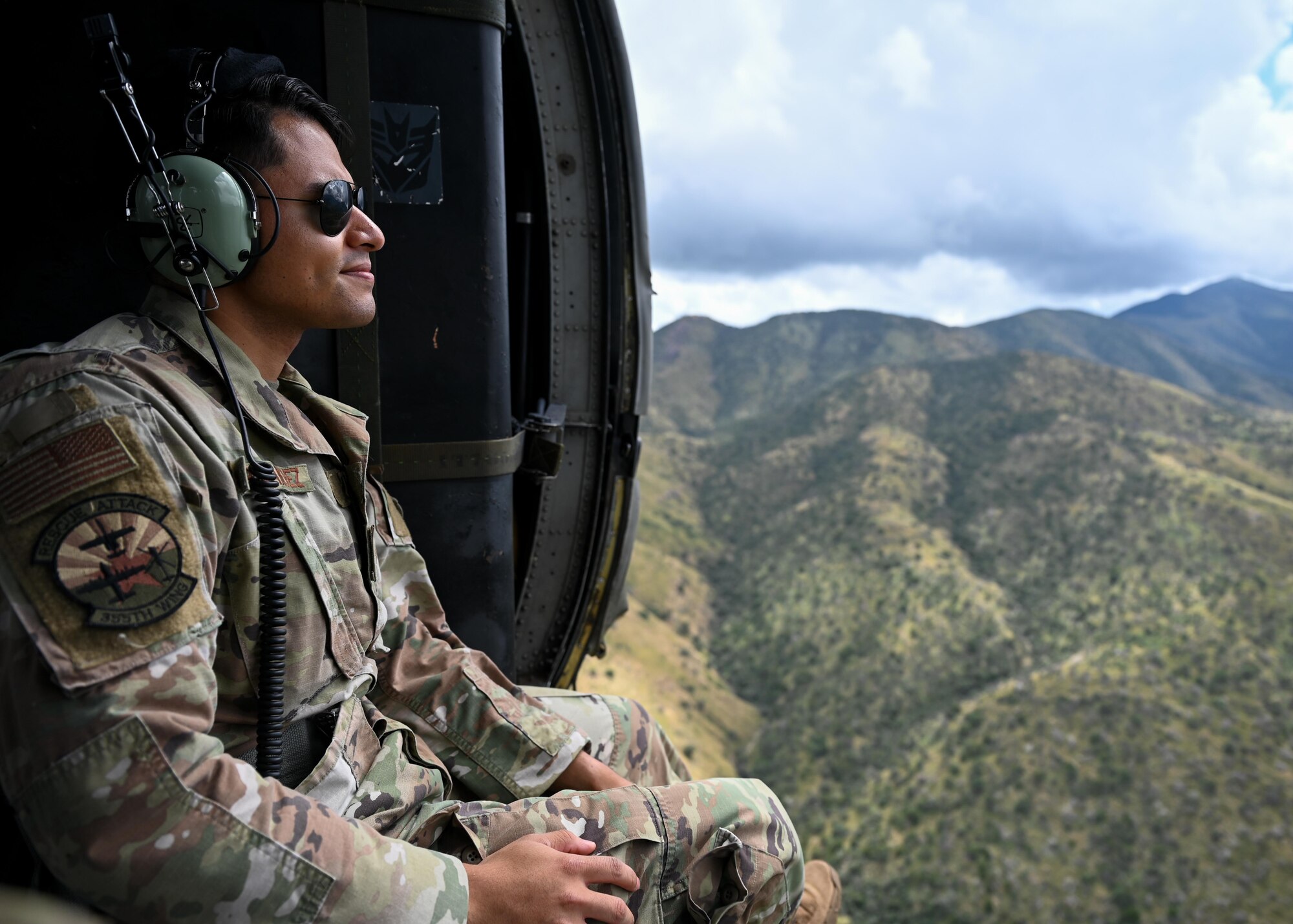 A photo of a man in a helicopter.