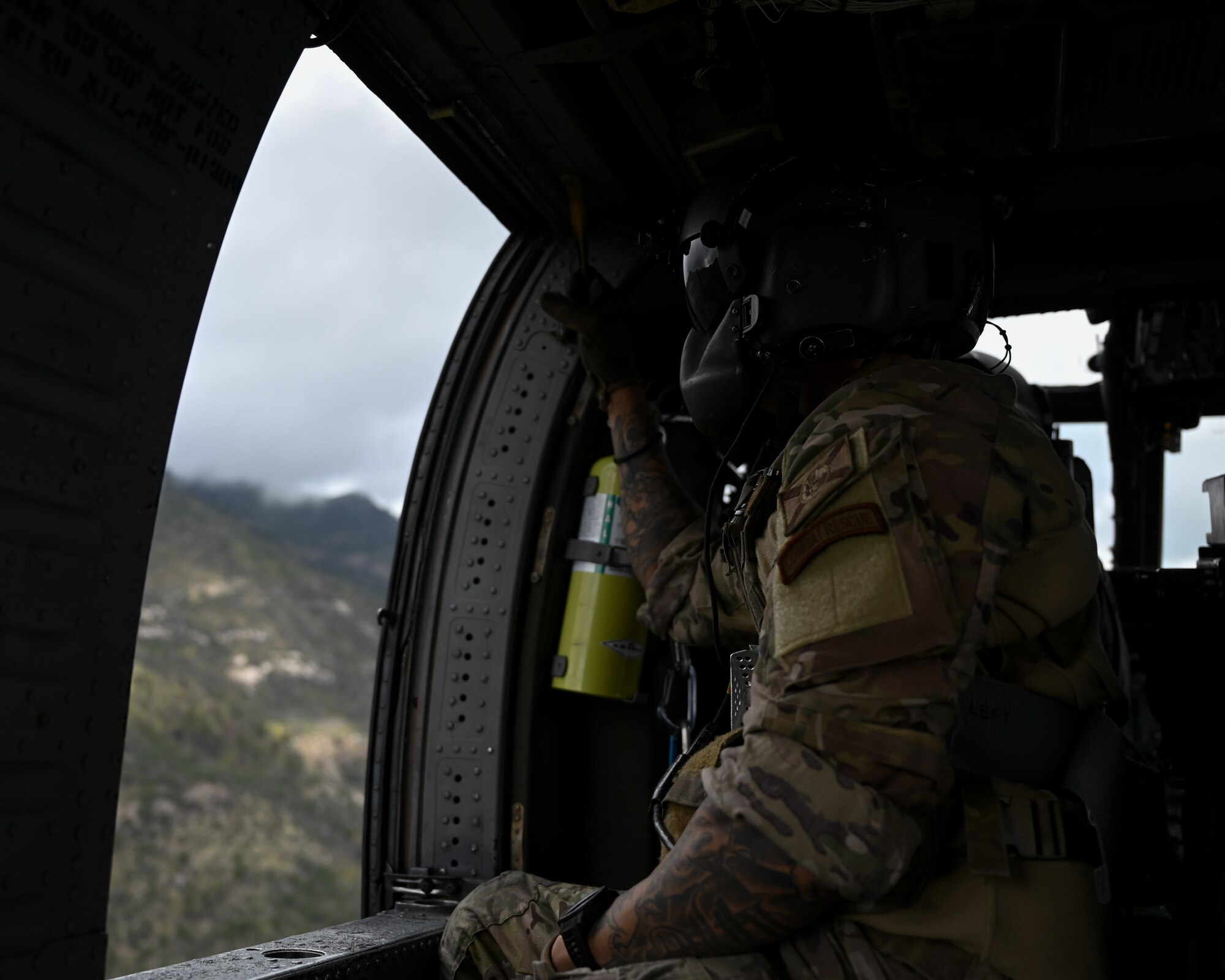 A photo of a man in a helicopter.