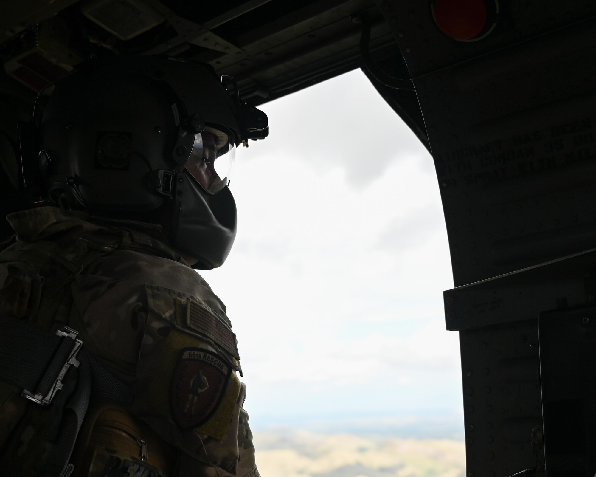 A photo of a man in a helicopter.