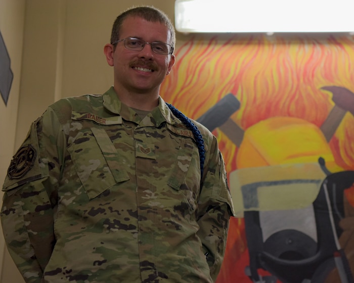 U.S. Air Force Staff Sergeant Derek Raber, 312th Training Squadron military training leader, stands in front of a mural, Goodfellow Air Force Base, Texas, Sept. 14, 2022. Raber has been an MTL at the 312th TRS since March of 2022, overseeing the daily lives of hundreds of Airmen in training. (U.S. Air Force photo by Senior Airman Michael Bowman)