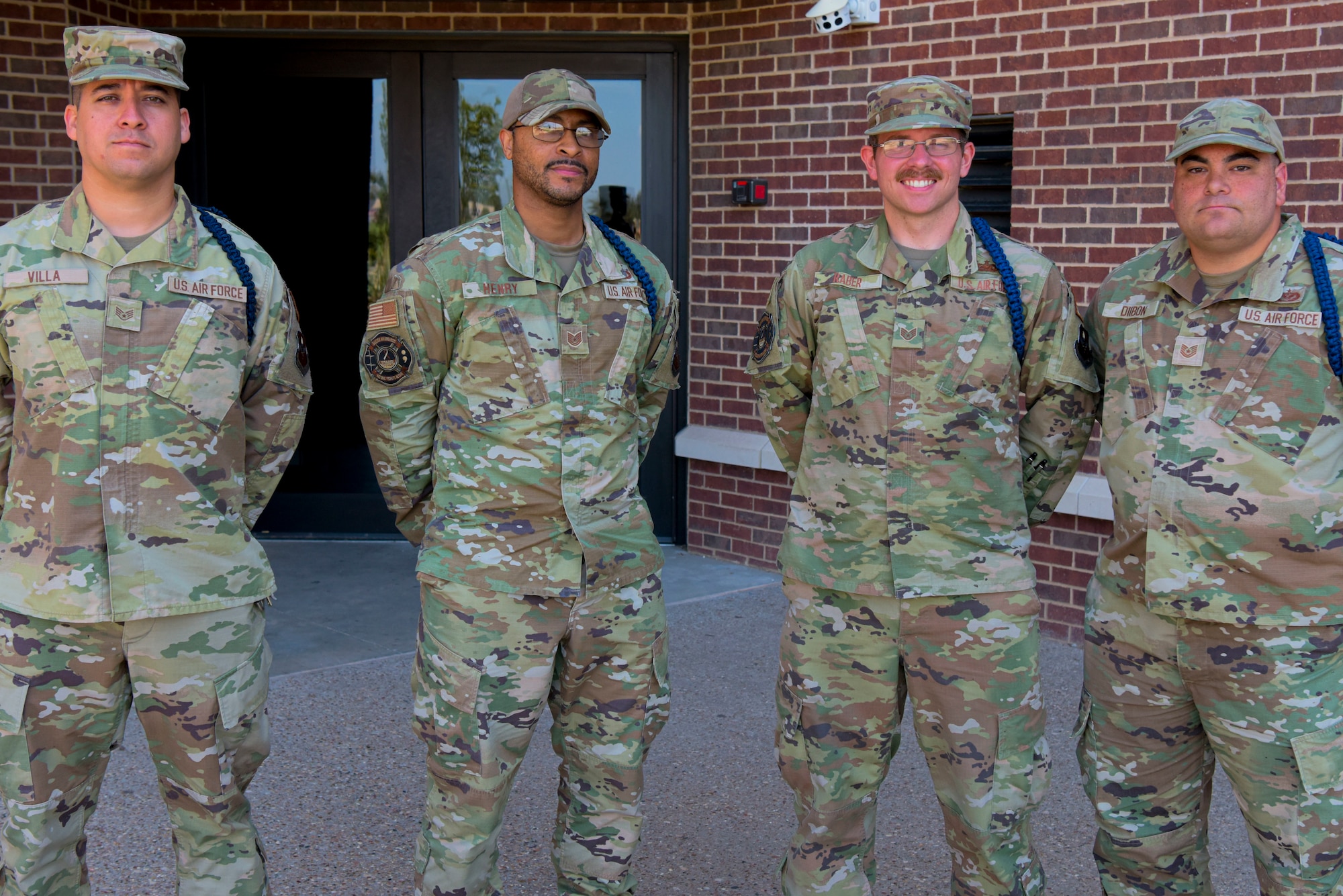 Military Training Leaders assigned to the 312th Training Squadron pose for a picture outside their squadron building, Goodfellow Air Force Base, Texas, Sept. 14, 2022. The 312th TRS is responsible for training all Department of Defense and firefighting professionals, and scientific applications specialists in the 9S100 career field. (U.S. Air Force photo by Senior Airman Michael Bowman)