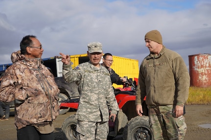 Alaska State Defense Force Staff Sgt. Timothy Henry, left, and Staff Sgt. (AK) Michael Uttereyuk identify storm damage with Maj. Gen. Torrence Saxe, adjutant general of the Alaska National Guard, in Scammon Bay, Alaska, Sept. 19, 2022. Approximately 100 members of the Alaska Organized Militia, which is comprised of the Alaska National Guard, Alaska State Defense Force and Alaska Naval Militia, were activated following a disaster declaration issued Sept. 17 after the remnants of Typhoon Merbok caused dramatic flooding across more than 1,000 miles of Alaskan coastline. (Alaska National Guard photo by Dana Rosso)