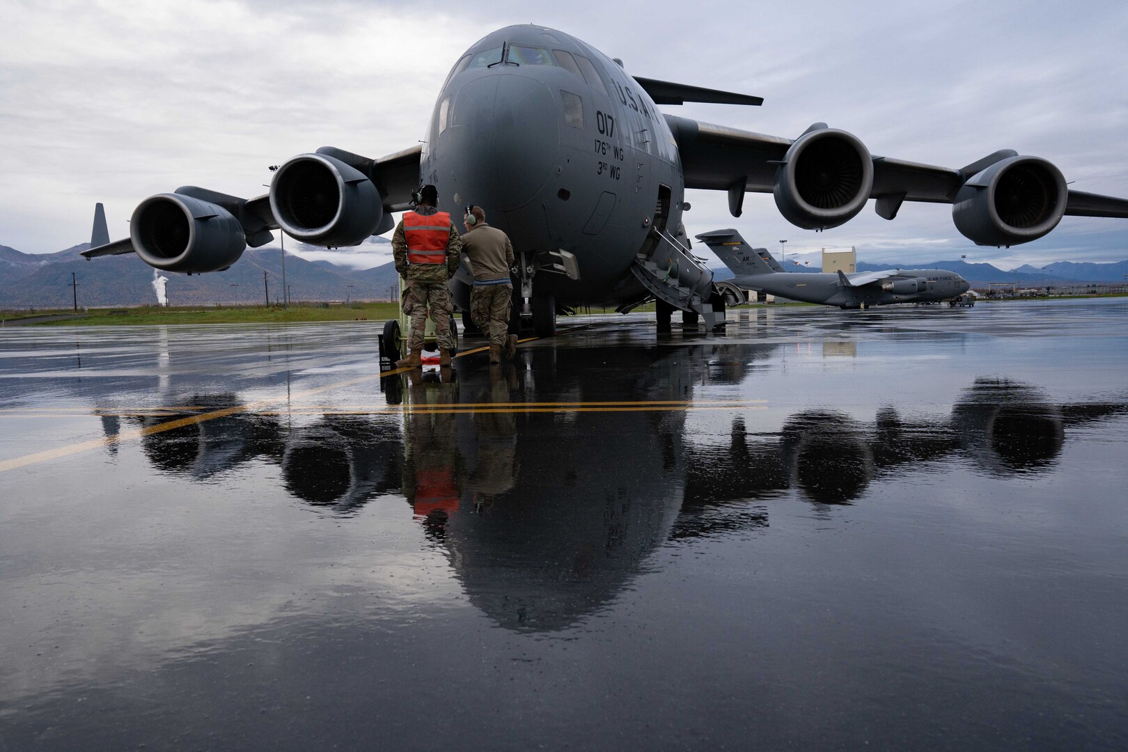An aircraft sits on a runway.