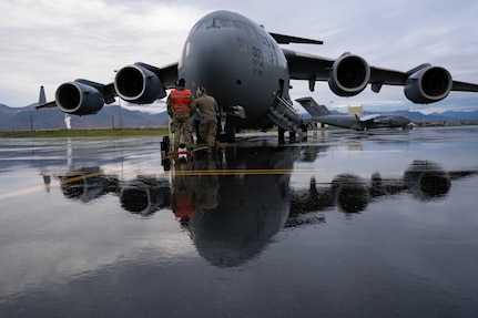 An aircraft sits on a runway.