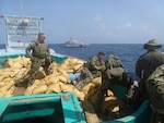 GULF OF OMAN (Sept. 27, 2022) A U.S. Coast Guard interdiction team seizes bags of illegal narcotics from a fishing vessel interdicted by fast response cutter USCGC Charles Moulthrope (WPC 1141) in the Gulf of Oman, Sept. 27.