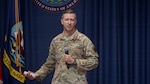 U.S. Air Force Col. Nathan Colunga, Special Warfare Training Wing commander, addresses the audience at the SWTW all-call on Joint Base San Antonio-Lackland, Texas, Sept. 27, 2022. At the all-call, the SWTW command team outlined its expectations and priorities for the wing.