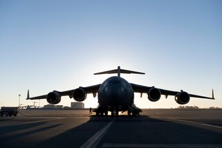 A U.S. Air Force C-17 Globemaster III sits on the flight line at Travis Air Force Base, California, Sept. 23, 2022. A Reserve aircrew from the 301st Airlift Squadron performed a three-day mission Sept. 23 – 25, to move humanitarian cargo to Haiti. Through the Denton Program, three school buses donated from San Diego Unified School District were transported from March Air Reserve Base, California, to Haiti. (U.S. Air Force photo by Senior Airman Jonathon Carnell)