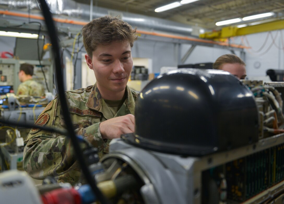 U.S. Air Force Airman 1st class Phaelan Lewis-Volenec, 36th Electronic Warfare Squadron technician, de-panels a AN/ALQ-184 Electronic Attack Pod for the Reclamation of Electronic Attack Pods (REAP) Program at Eglin Air Force Base, Florida, September 14, 2022. The REAP P Program is intended to sustain the service life of the AN/ALQ-184 ECM Pod legacy system by increasing the availability of parts for essential repairs across the U.S. Air Force. (U.S. Air Force photo by Staff Sgt. Ericka A. Woolever)