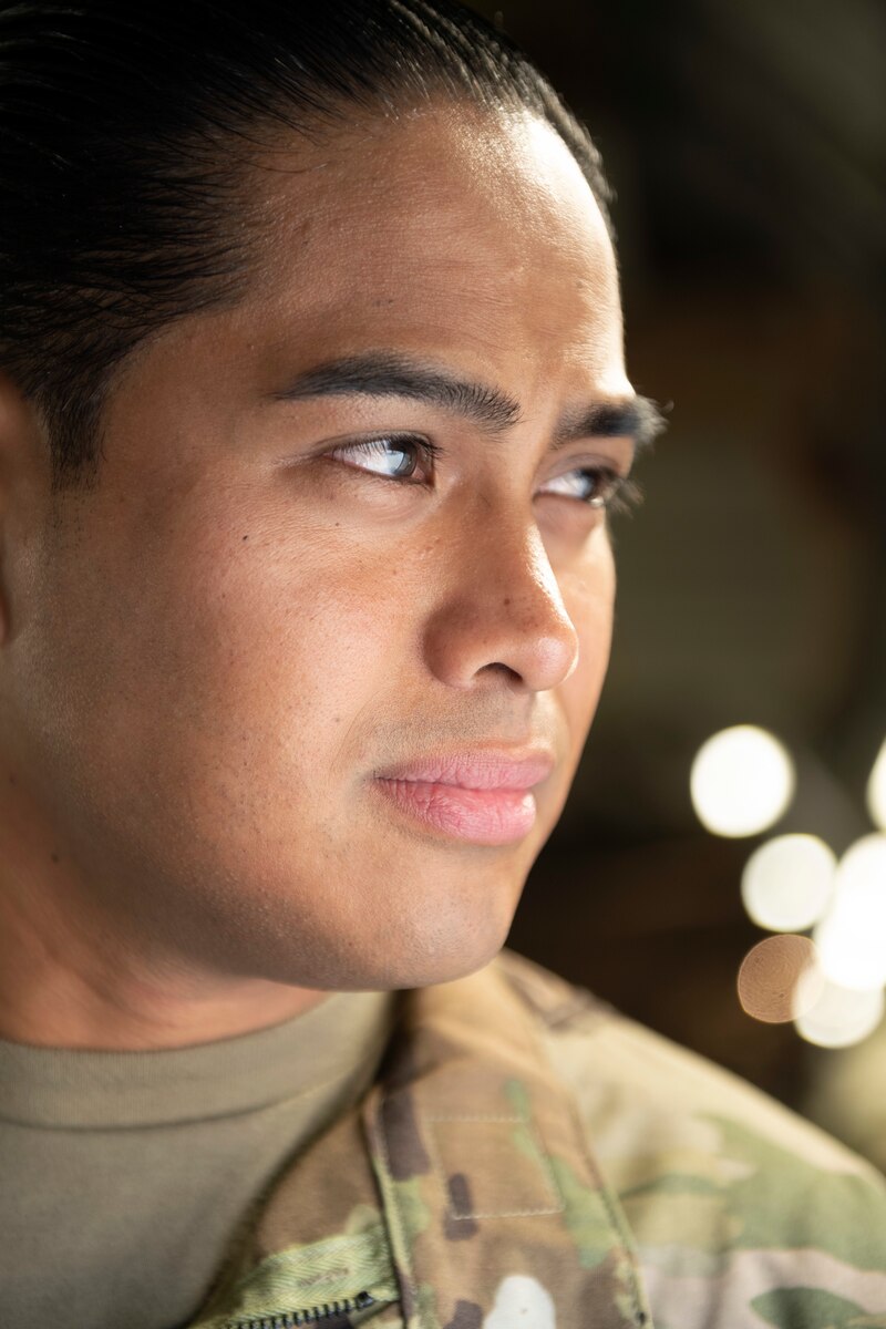 U.S. Air Force Master Sgt. Alexander Bombita, 349th Security Forces Squadron Phoenix Raven, looks outside a C-17 Globemaster III at Travis Air Force Base, California, Sept. 23, 2022. A Reserve aircrew from the 301st Airlift Squadron performed a three-day mission Sept. 23 – 25, to move humanitarian cargo to Haiti. Through the Denton Program, three school buses donated from San Diego Unified School District were transported from March Air Reserve Base, California, to Haiti. (U.S. Air Force photo by Senior Airman Jonathon Carnell)