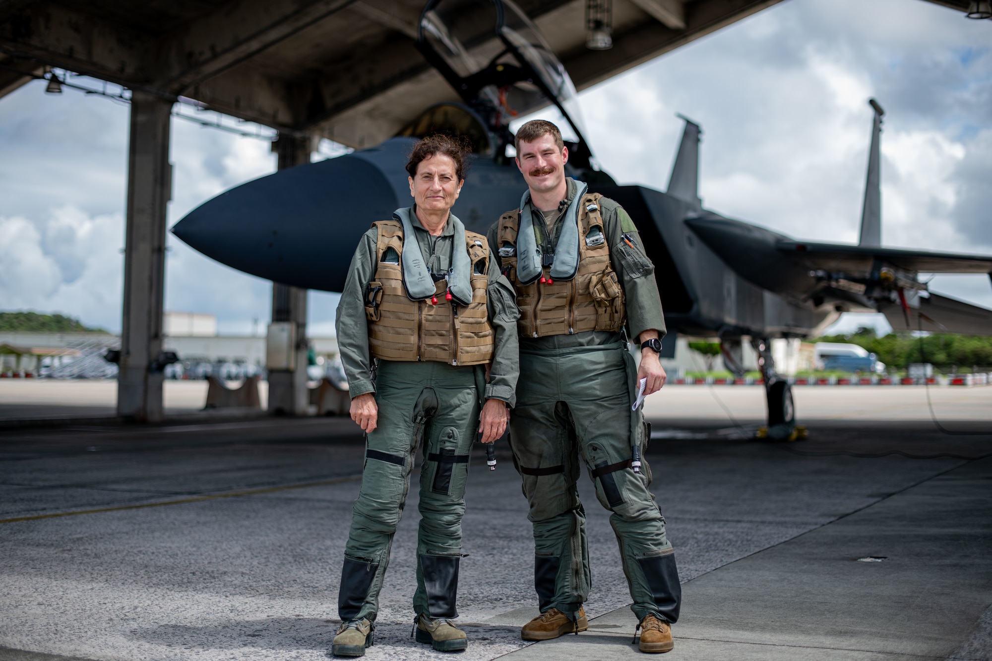 Doctor and pilot pose for a picture.
