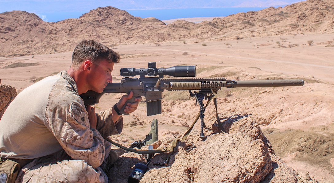 Designated Marksman with FASTCENT provide over watch during squad attack live fire ranges as part of platoon level training taking place during EAGER LION 22