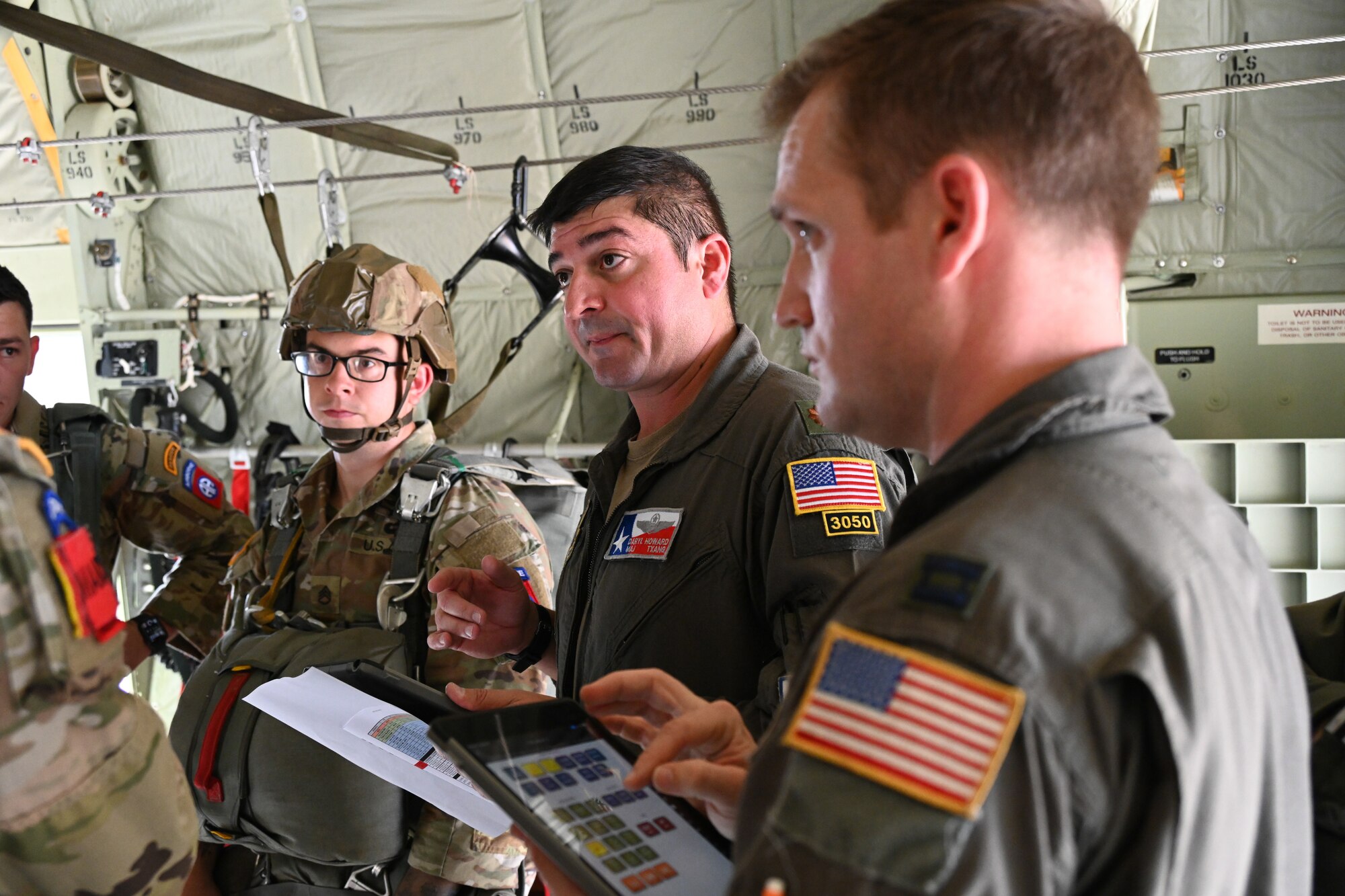Pilot briefs crew prior to take-off.