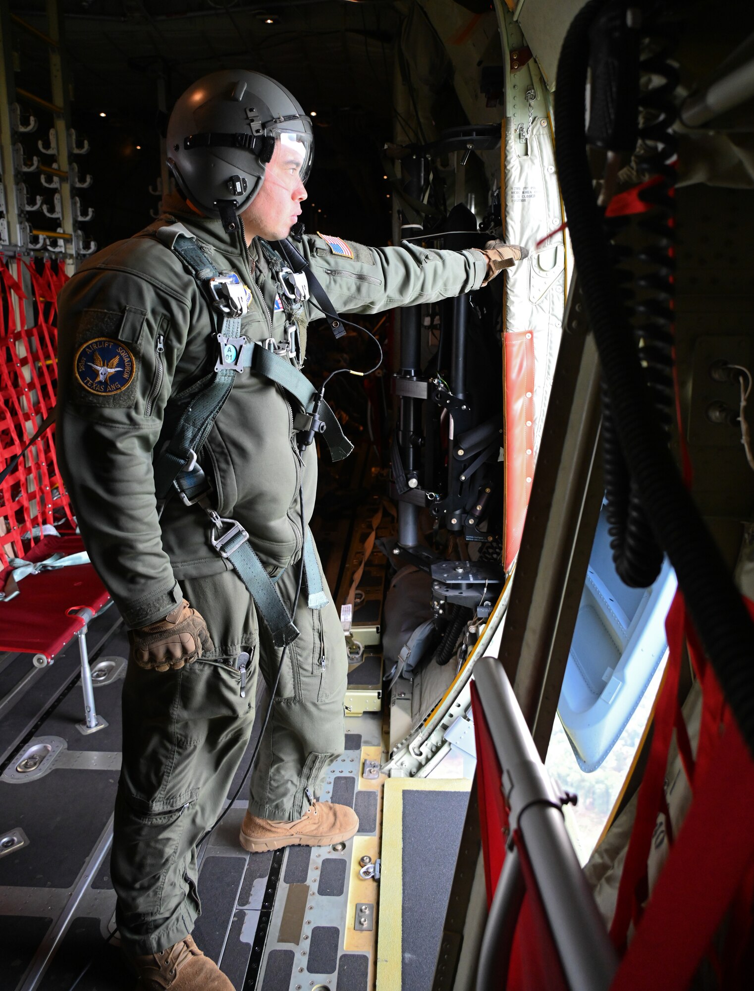 C-130J loadmaster waits to close the door.