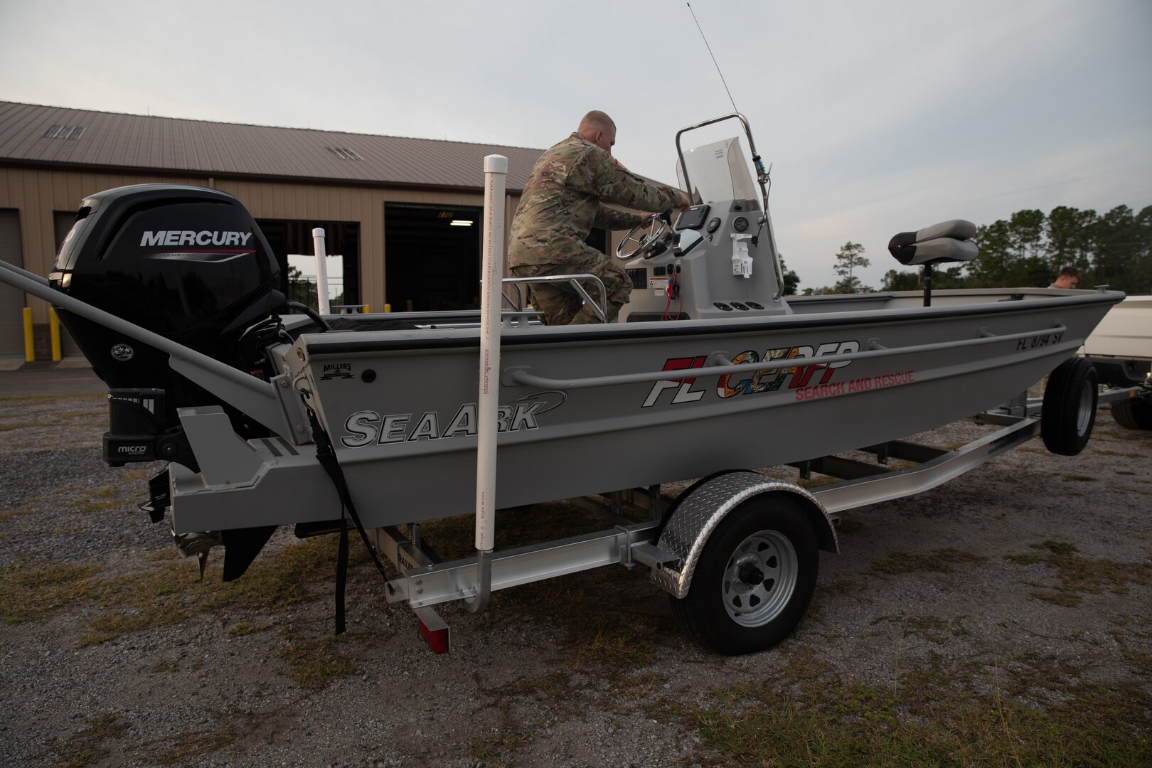 Florida National Guard Army Pfc. Kenneth Bonn, a combat engineer with the 753rd Engineering Brigade, inspects a search and rescue vessel during Hurricane Ian state activation, Camp Blanding Joint Training Center, Fla., Sept. 27, 2022. Bonn is part of the Florida National Guard's Chemical, Biological, Radiological/Nuclear, and Explosive (CBRNE) - Enhanced Response Force Package (FL-CERFP).