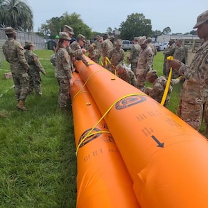 Florida National Guard Soldiers with the 146th Expeditionary Signal Battalion completed training on the Tiger Dam system. This system is a water filled bladder capable of diverting flood waters within minutes.