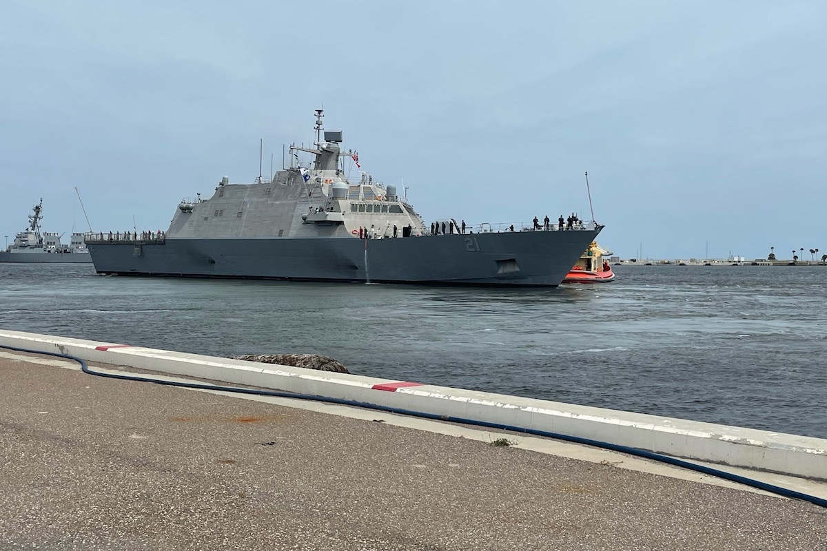 A large ship floats in a harbor.