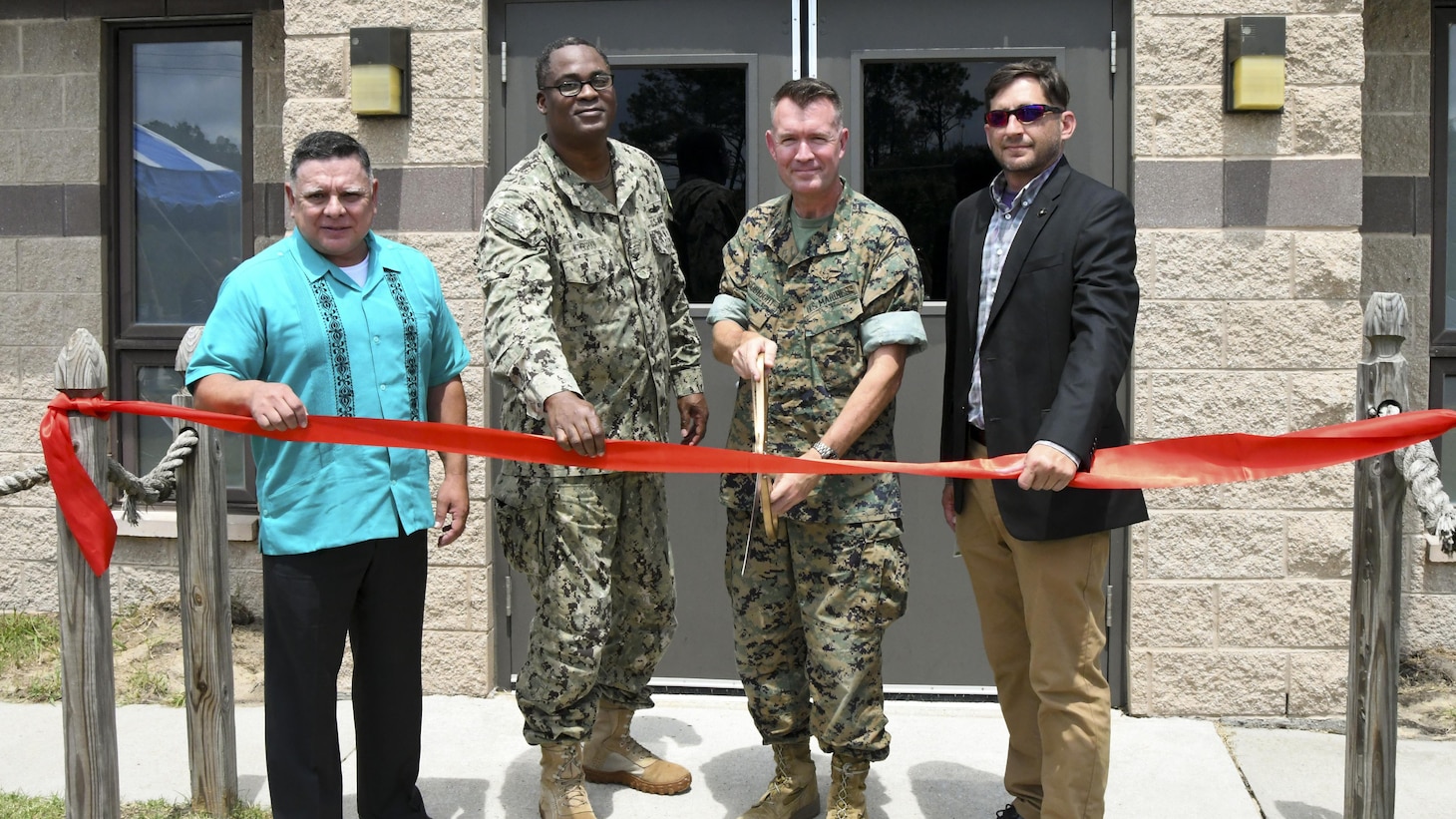 Col. Victor Argobright, Navy and Marine Corps Small Tactical Unmanned Aircraft Systems program manager, officially opens the Navy Training and Logistics Support Activity East