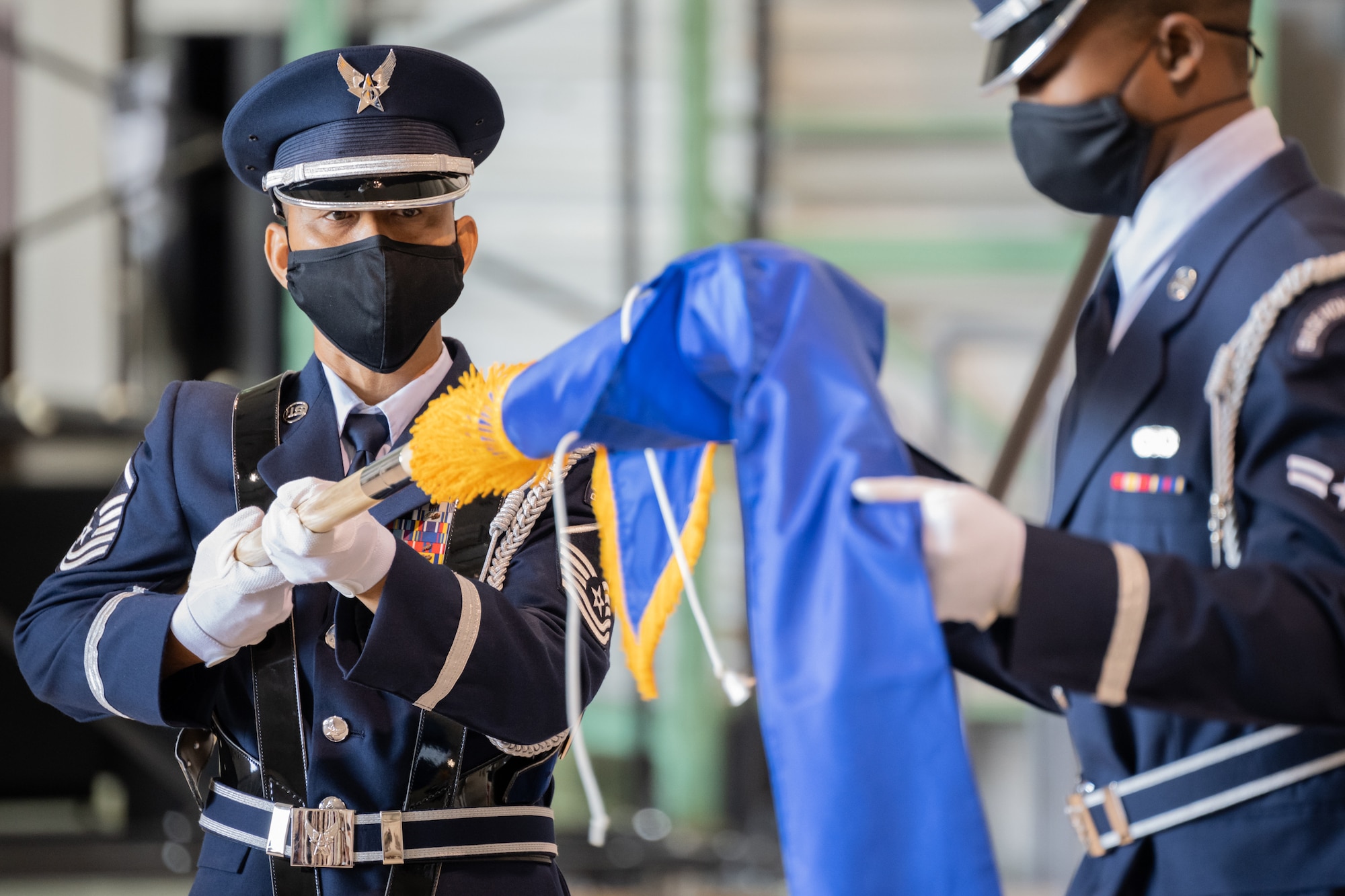 Members of the 123rd Airlift Wing Color Guard unfurl the personal flag of Brig. Gen. David J. Mounkes during a promotion and change-of-command ceremony held at the Kentucky Air National Guard Base in Louisville, Ky., Aug. 13, 2022. Mounkes assumed command of the Kentucky Air Guard at the event, taking on the role of assistant adjutant general for Air from Brig. Gen. Jeffrey L. Wilkinson, who is retiring. (U.S. Air National Guard photo by Dale Greer)