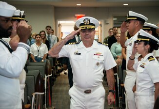 NEWPORT, R.I. (Sept. 22, 2022) Capt. Brian Mutty, commanding officer, Surface Warfare Schools Command (SWSC), passes through sideboys during SWSC’s Department Head Class 268 graduation ceremony at Naval Station Newport, Sept. 22, 2022. The SWSC Department Head Course is the cornerstone of a surface warfare officer's tactical education in their naval career. The graduates will take the knowledge back to the fleet, where they will teach the next generation of surface warfare leaders. These career naval professionals are part of a long tradition of 60 years of excellence at SWSC, previously known as Surface Warfare Officers School Command, as the Navy continues to build, maintain, train, and equip a combat-credible, dominant naval force to keep the sea lanes open and free, deter conflict, and when called upon, decisively win the nation’s wars.. (U.S. Navy photo by Mass Communication Specialist 2nd Class Derien C. Luce)