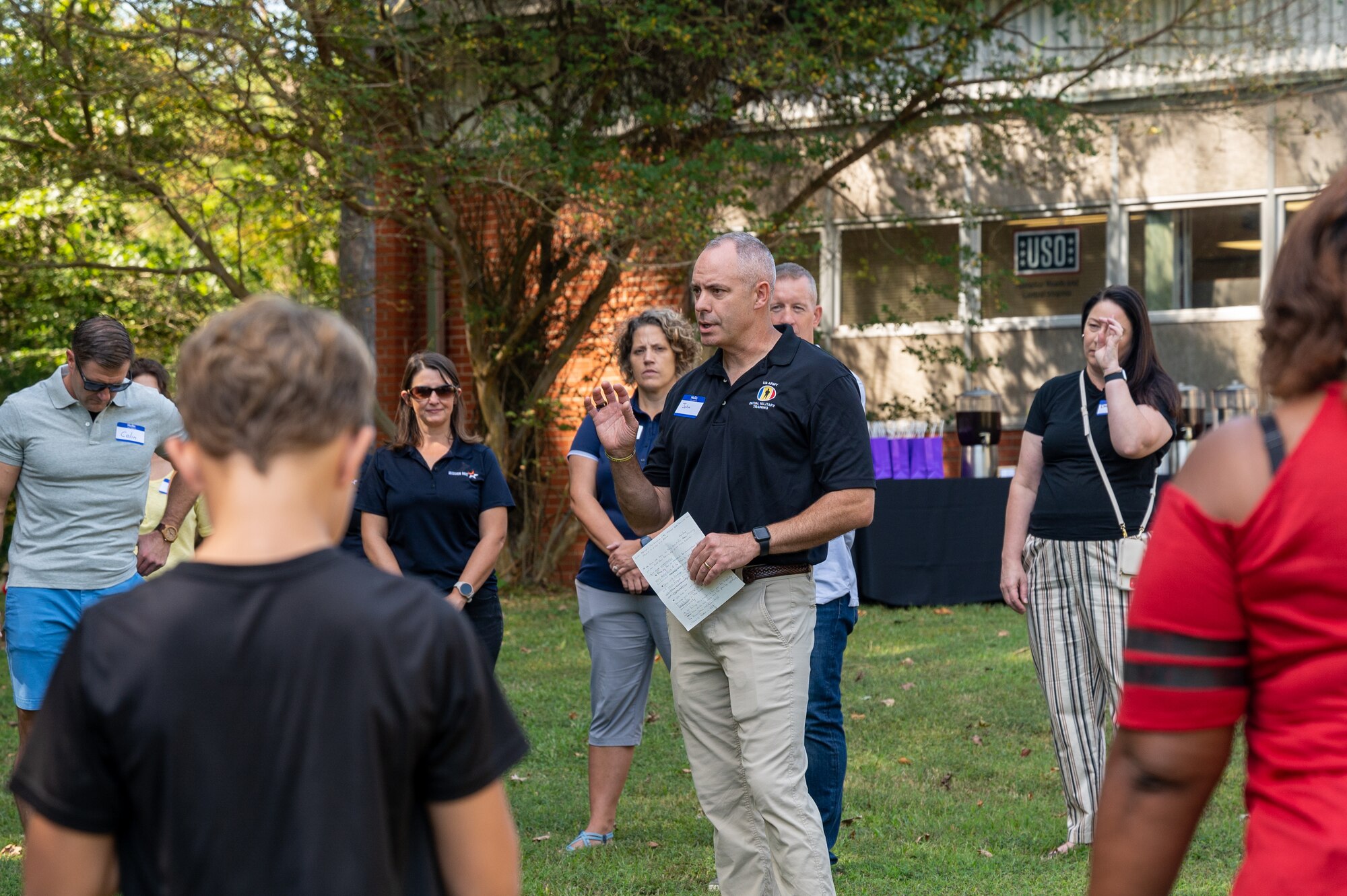 U.S. Army Brig. Gen. John Kline shares remarks with a group of people.