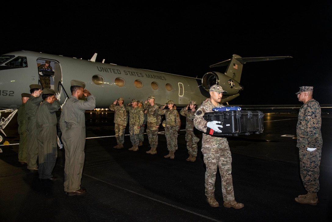 Members of the Defense POW/MIA Accounting Agency (DPAA) conduct an honorable carry, Sept. 16, 2022, at Joint Base Pearl Harbor-Hickam, Hawaii. The remains returned from Solomon Islands where Allied forces faced Imperial Japan during World War II. DPAA's mission is to achieve the fullest possible accounting for missing and unnaccounted-for U.S. personnel to their families and our nation. (U.S. Air Force photo by Staff Sgt. James Thompson)