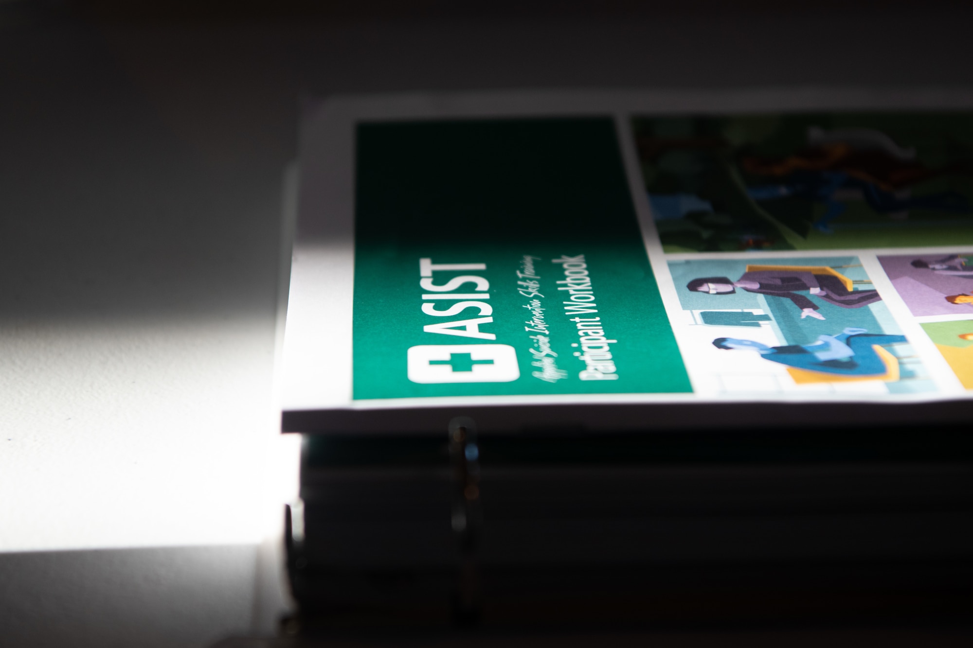 An Applied Suicide Intervention Skills Training (ASIST) workbook is used during a suicide prevention training program held in the base chapel at Beale Air Force Base, Calif., on Sept. 22, 2022